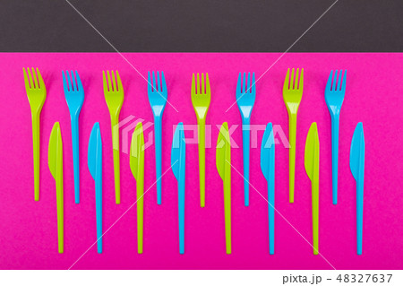 Many color plastic cutlers on a bright background 48327637