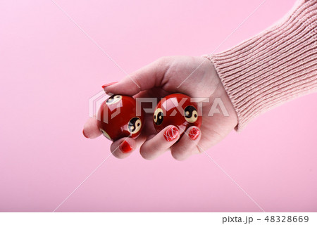 Chinese feng shui balls in the hand of a girl Chinese feng shui balls in the hand of a girl 48328669