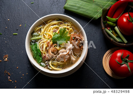 Soup noodles in bowl 48329498