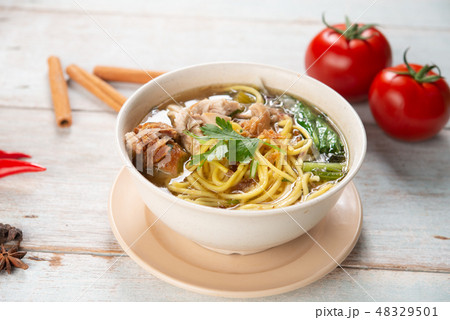 Soup noodles in bowl 48329501