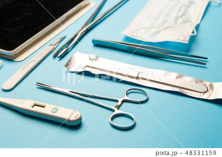 Tablet pc and doctor tools on blue surface 48331159