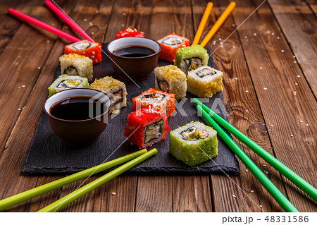Sushi Set rolls with soy sauce served on gray stone slate 48331586