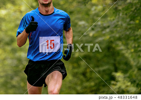 athlete runner in blue t-shirt athlete runner in blue t-shirt 48331648