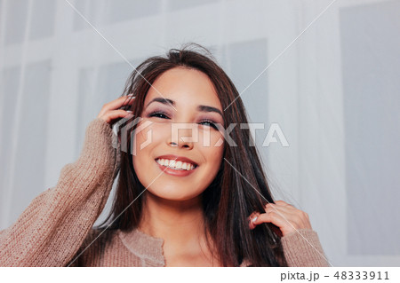 Candid portrait of sensual smiling asian girl 48333911