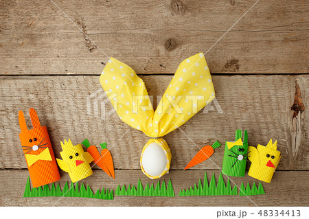 Row of funny easter bunnies and easter egg Row of funny easter bunnies and easter egg 48334413