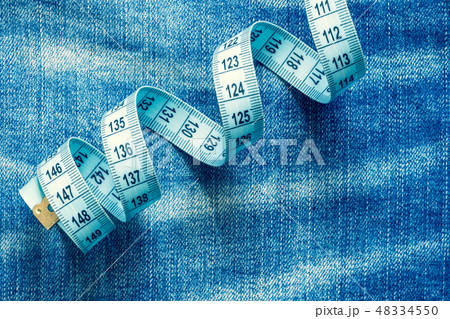 Jeans and measuring tape 48334550