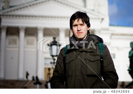 Young man tourist in a city Young man tourist in a city 48342693