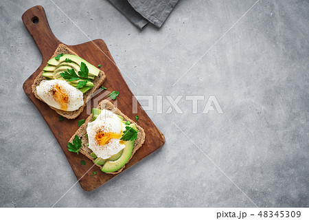 Poached Eggs and Avocado Sandwiches Poached Eggs and Avocado Sandwiches 48345309