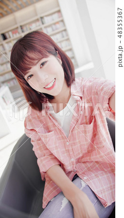 young woman take a selfie 48355367