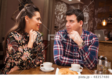 Beautiful inlove couple on a date in vintage pub Beautiful inlove couple on a date in vintage pub 48357480