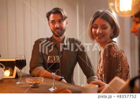 Fashionable young woman feeling good and laughing in a vintage pub 48357752