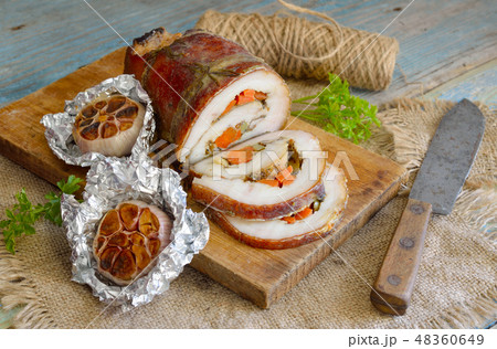 Stuffed Pork Loin Roast with baked garlic 48360649