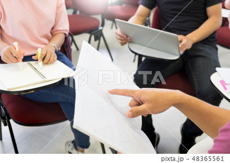 Adult students group listen to professor's lecture and Asking Qu Adult students group listen to professor's lecture and Asking Qu 48365561