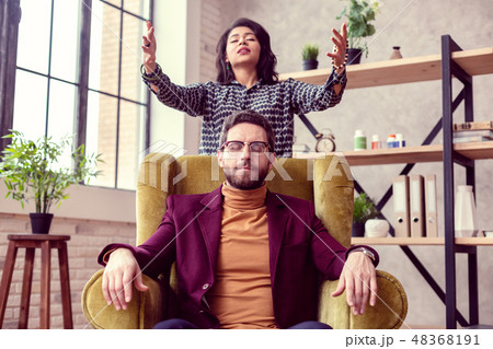 Beautiful female witch casting a special spell 48368191