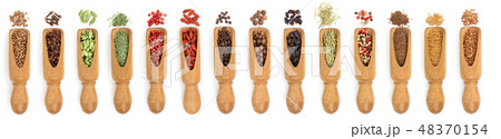 mix of spices in wooden scoop isolated on a white background. Top view. Flat lay. Set or collection 48370154
