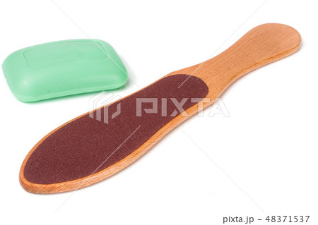 wooden double-sided grater for feet with soap isolated on white background 48371537