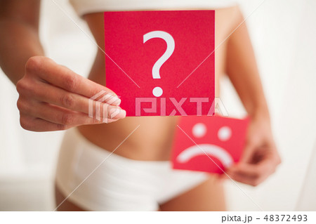 Health. Woman Body In Underwear With Question Card Near Belly Health. Woman Body In Underwear With Question Card Near Belly 48372493