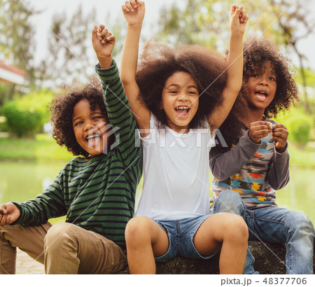 Happy kids group playing in the park in school. 48377706