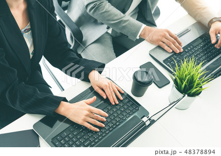 Businessman and businesswoman working in office. Businessman and businesswoman working in office. 48378894