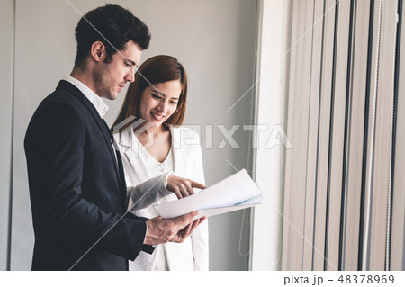 Businesswoman meeting with businessman in office. Businesswoman meeting with businessman in office. 48378969