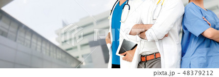 Doctor working in hospital with other doctors. 48379212