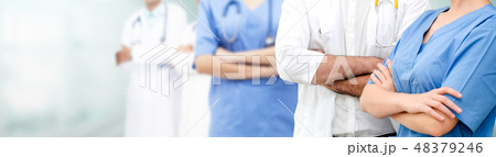 Doctor working in hospital with other doctors. 48379246