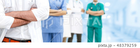 Doctor working in hospital with other doctors. Doctor working in hospital with other doctors. 48379259