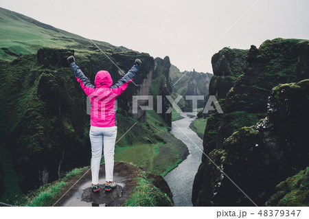 Woman traveller at Fjadrargljufur in Iceland. Woman traveller at Fjadrargljufur in Iceland. 48379347