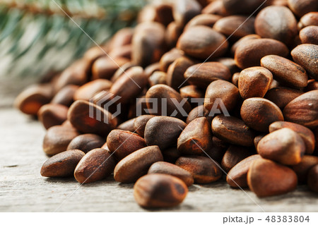 Pine nuts in a bag of burlap on an old vintage  48383804