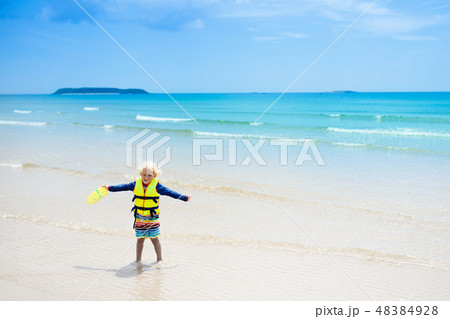 Child on tropical beach. Sea vacation with kids. Child on tropical beach. Sea vacation with kids. 48384928