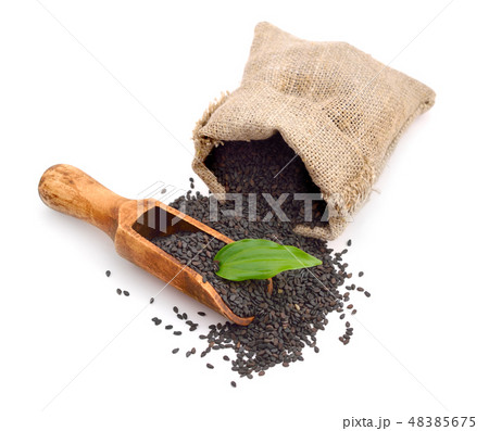 Black sesame seeds. Isolated on white background. Black sesame seeds. Isolated on white background. 48385675
