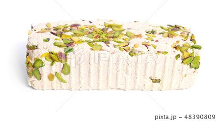 Tahini-based halva with pistachios. Isolated 48390809
