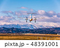 蔵王と着陸する飛行機 48391001