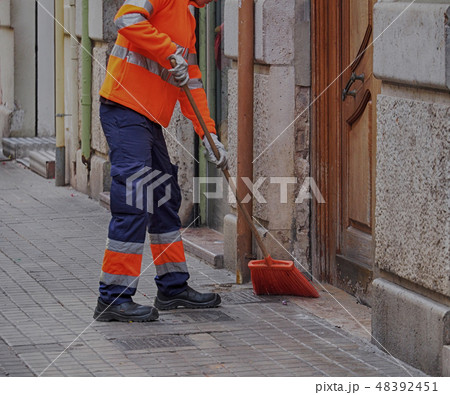 City workers - cleaning and washing of city street 48392451