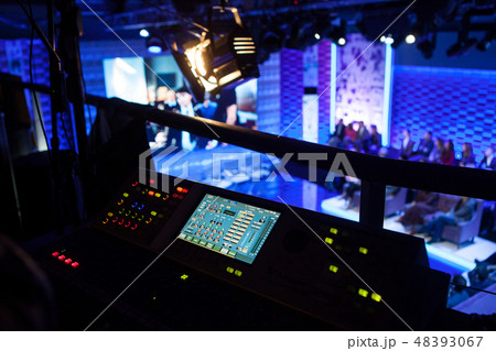 Backstage from the side of the mixing console in the television studio Backstage from the side of the mixing console in the television studio 48393067