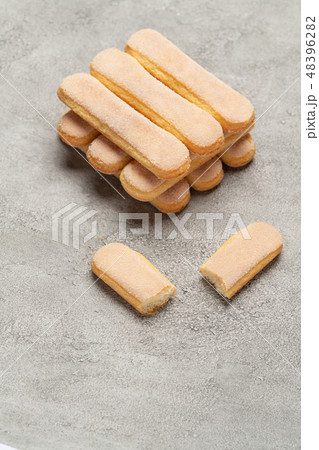 Italian Savoiardi ladyfingers Biscuits on concrete backgound Italian Savoiardi ladyfingers Biscuits on concrete backgound 48396282