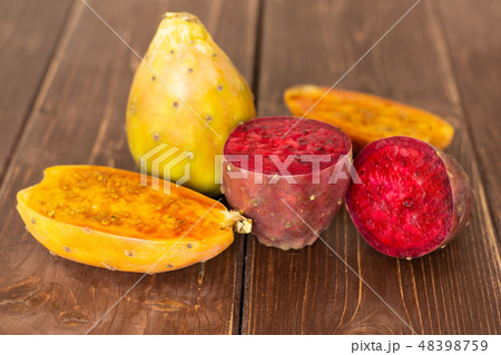 Fresh bright prickly pear opuntia on brown wood 48398759