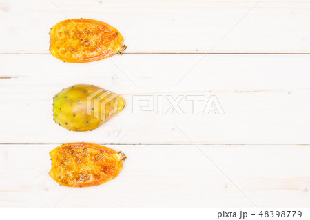 Fresh bright prickly pear opuntia on grey wood 48398779