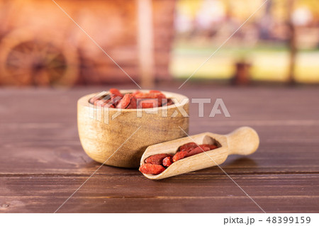 Dried red goji berries with cart 48399159