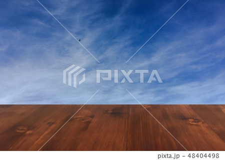 old brown oak wooden table on the blue sky clouds background, wood table old brown oak wooden table on the blue sky clouds background, wood table 48404498