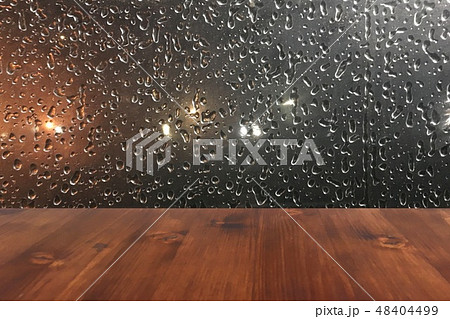 old brown oak wood table on the blurry drop on window background, wooden table. old brown oak wood table on the blurry drop on window background, wooden table. 48404499