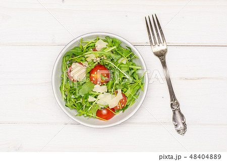 Recipe step by step arugula salad on grey wood 48404889