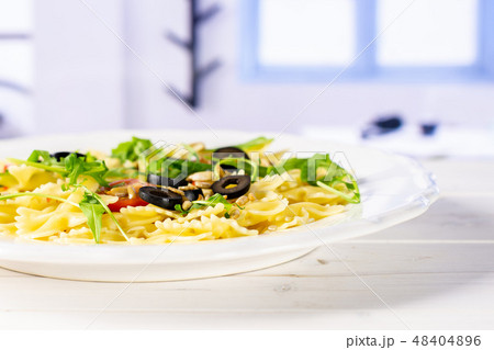 Recipe farfalle with arugula leaves blue window Recipe farfalle with arugula leaves blue window 48404896