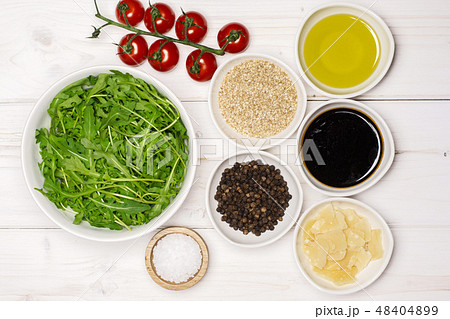 Recipe step by step arugula salad on grey wood 48404899