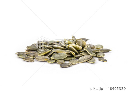 Hulled pumpkin seeds isolated on white Hulled pumpkin seeds isolated on white 48405329