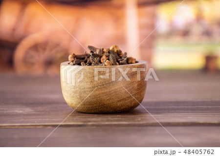 Small dried cloves spice with cart Small dried cloves spice with cart 48405762