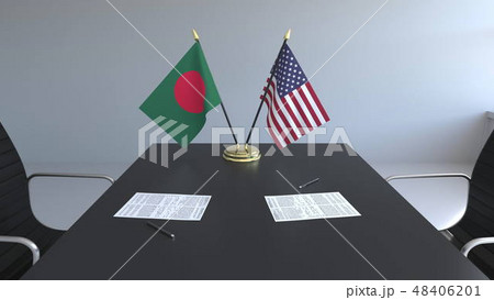 Flags of Bangladesh and the United States and papers on the table. Negotiations and signing an 48406201