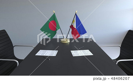 Flags of Bangladesh and Philippines and papers on the table. Negotiations and signing an 48406207