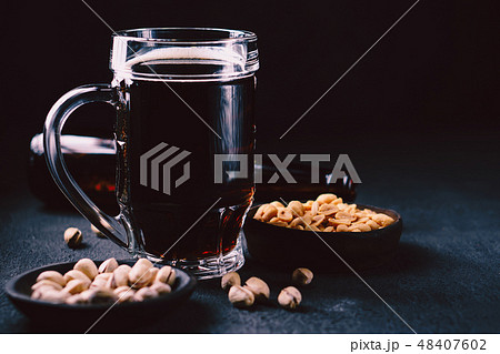 bar table. dark craft stout beer and snacks set 48407602