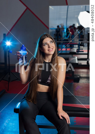 Beautiful sexy fitness model resting after workout 48408032